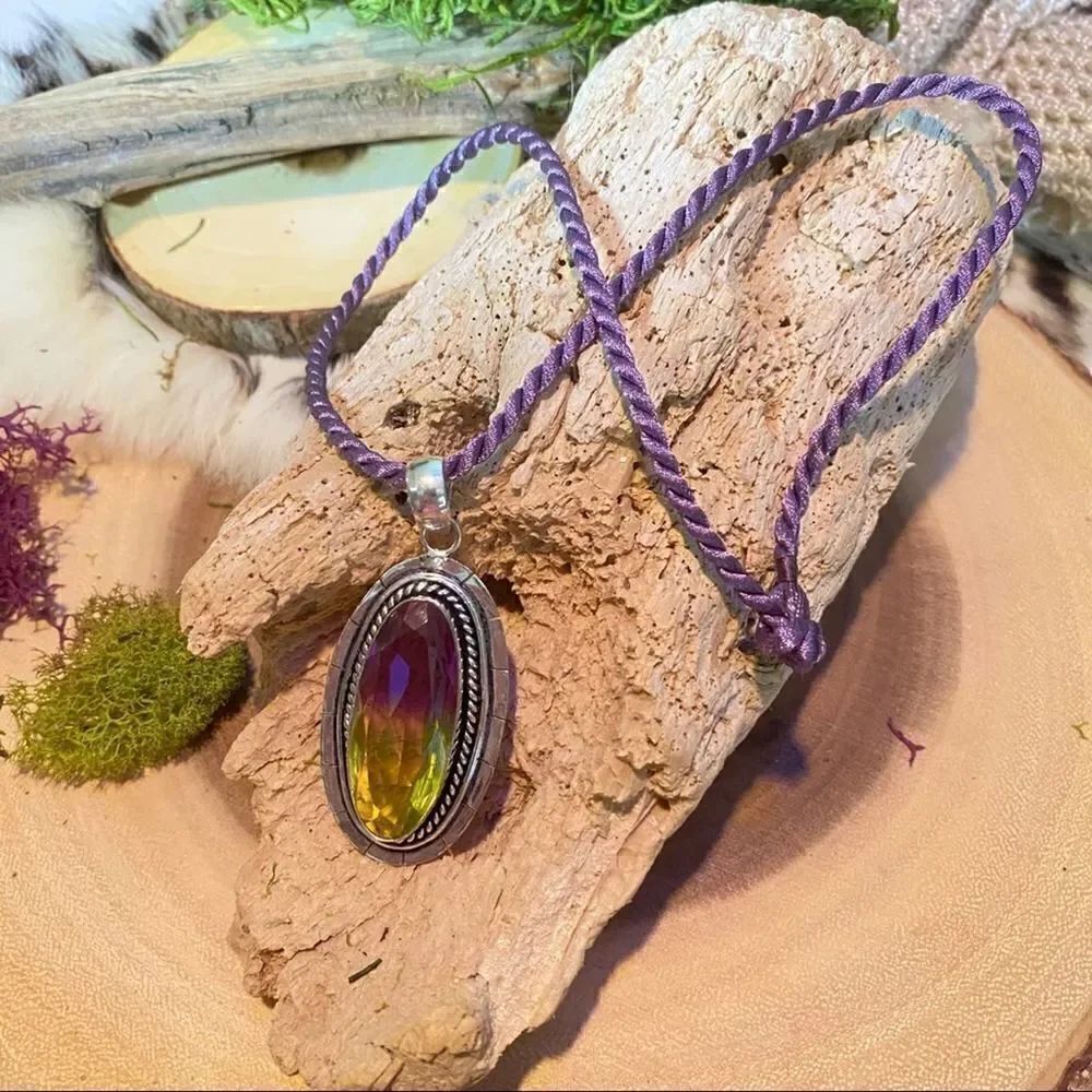 Bi-Color Tourmaline pendant on purple silk cord